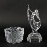 A Kosta Boda moulded glass bowl and an Art Deco style lady, each of clear glass,