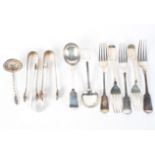 An assortment of siver spoons, tongs, forks and other items,