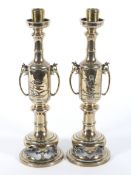 A pair of Japanese Meiji (1868-1912) gilt metal pierced candlesticks,