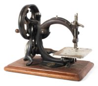 A 19th century Willcox & Gibbs sewing machine, mounted with gilt metal manuacturer's plaque,