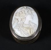 A 19th century oval silver snuff box inset with carved ivory portrait of a maiden, of oval form,