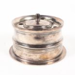 A silver capstain inkwell in the form of a part fly fishing real,