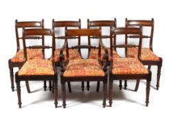 Seven mid-19th century mahogany dining chairs, with bar backs and spirally carved backs,