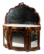 A Victorian mirror backed serpentine mahogany marble topped credenza,