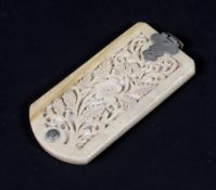 A late 19th century carved ivory retractable aide-memoire, carved with floral frettwork,