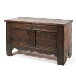 An 18th century carved oak coffer,