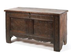 An 18th century carved oak coffer,