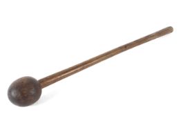 A Polynesian turned wood throwing club, with bulbous head,