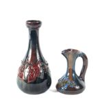 An Elton Ware pottery vase and a ewer, each with blue mark, each moulded with flowering branches,