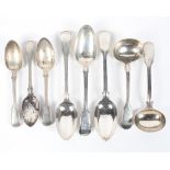 An assortment of Georgian and Victorian silver spoons, including serving, ladles and dessert spoons,