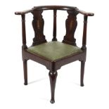 A Georgian mahogany corner elbow chair,