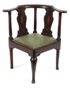 A Georgian mahogany corner elbow chair,