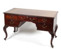 A late 19th century mahogany desk, with frieze drawer flanked by two banks of short drawers,