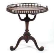 A Georgian style mahogany galleried tripod table, with spindle gallery above tri-scroll support,