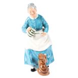 A Royal Doulton figure of an old lady feeding a cat, titled 'The Favourite', printed green marks,