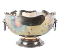 A 20th century silver plated rose bowl, with beaded waved rim and ring and lion mask handles,