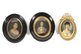 Three oval portrait miniatures of women, 19th century and later, each oil on panel,