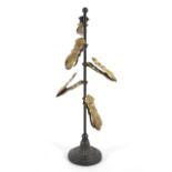 A steel and brass letter tree, with five gilt metal hand-shaped clips,