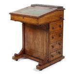 An Edwardian inlaid mahogany davenport, with piered brass gallery above green leather inset top,