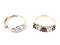 An Art Deco style 9ct gold and platinum set three stone diamond ring, size L,