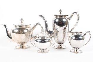 A Four piece silver tea set comprising a tea & coffee pot,