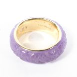 A 14ct gold ring, the exterior covered in heavily carved quartz,