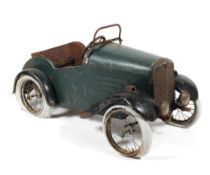 An early to mid 20th century child's toy pedal car.