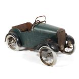 An early to mid 20th century child's toy pedal car.