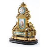 A late 19th century gilt metal and Sevres-style porcelain mounted mantel clock,