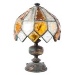 A Tiffany style gilt-metal mounted table lamp, 20th century, with twin lights,