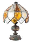 A Tiffany style gilt-metal mounted table lamp, 20th century, with twin lights,