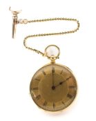 A Victorian yellow metal ladies fob watch with chain and key,
