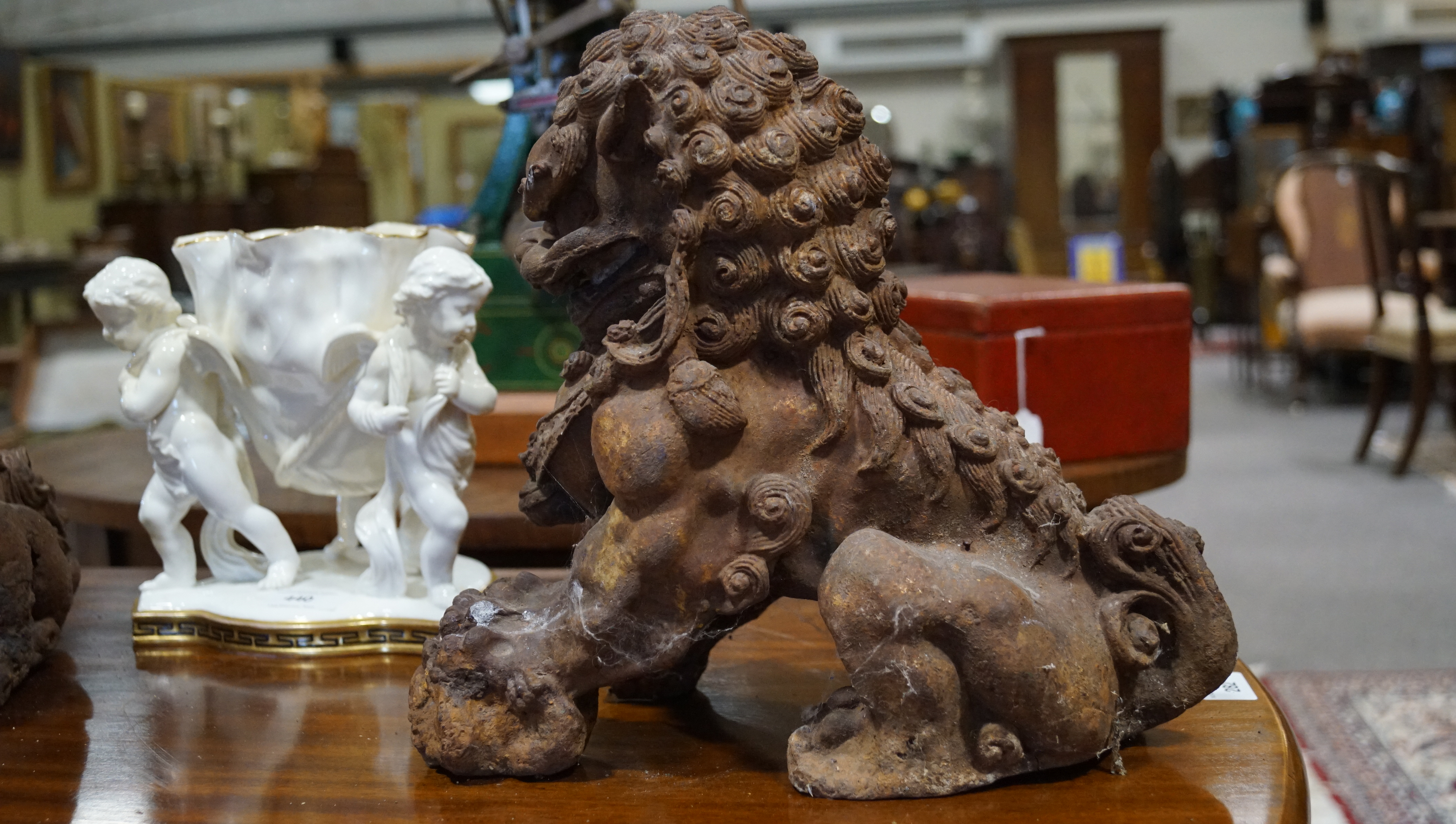 A pair of Chinese cast iron lions, each modelled seated with front paw on a brocaded ball, - Image 8 of 15