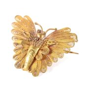 A yellow metal pierced filigree butterfly brooch, unmarked,