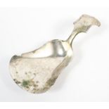 A 19th century Dutch silver caddy spoon, with embossed shell motif to handle,
