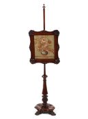 A Victorian carved mahogany pole screen with tapestry screen,