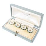 A pair of gents 18ct cufflinks by Gowland Bros Ltd, set with mother of pearl and enamel border,