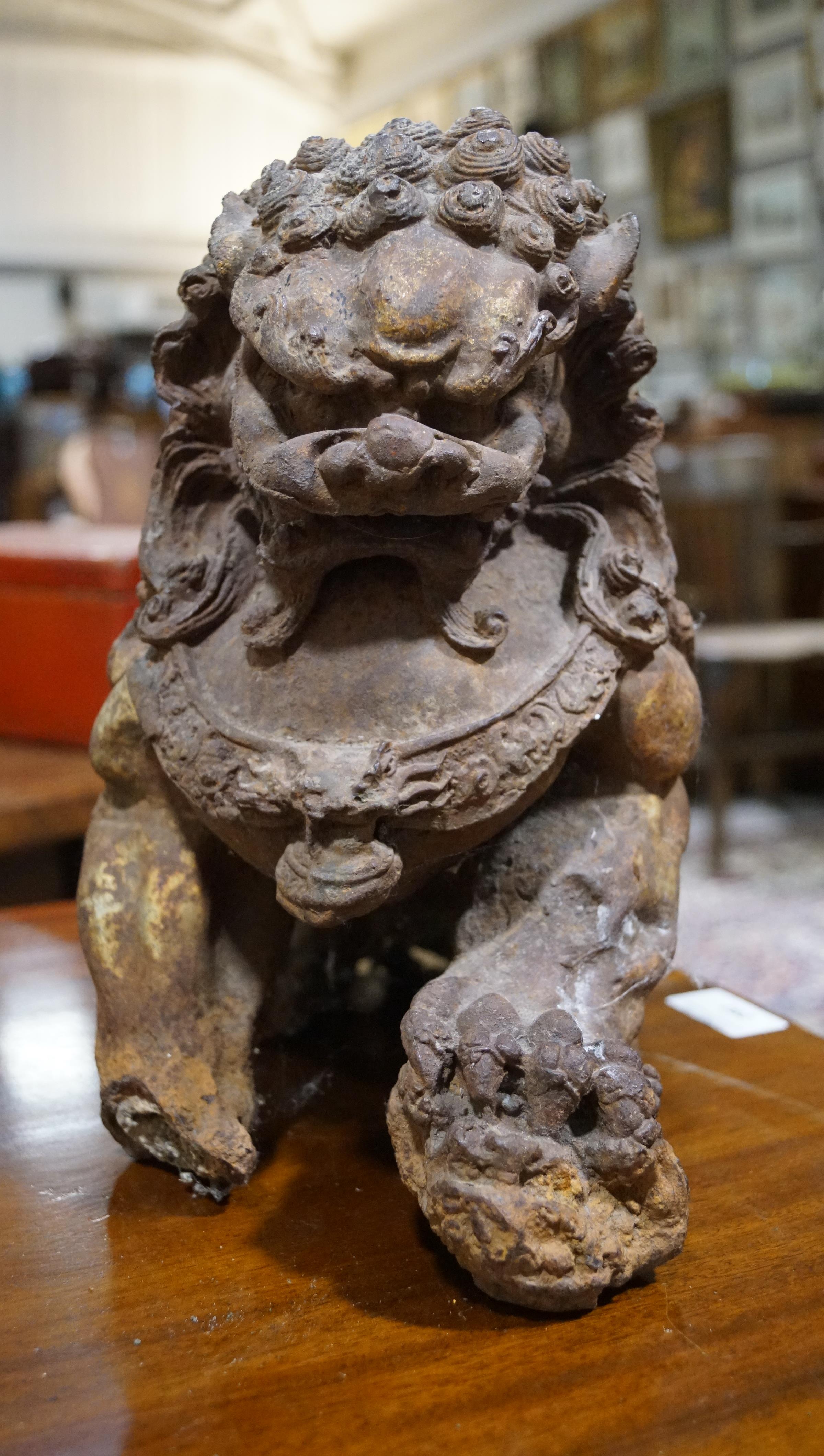 A pair of Chinese cast iron lions, each modelled seated with front paw on a brocaded ball, - Image 13 of 15