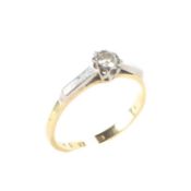 An 18ct gold and platinum set solitaire diamond ring, with raised platinum shoulders, size L,