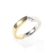 An 18ct white and yellow gold and diamond solitaire ring, marked 750,
