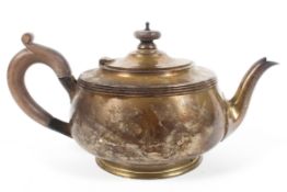 A silver tea pot,