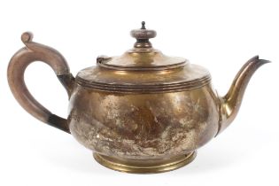 A silver tea pot,