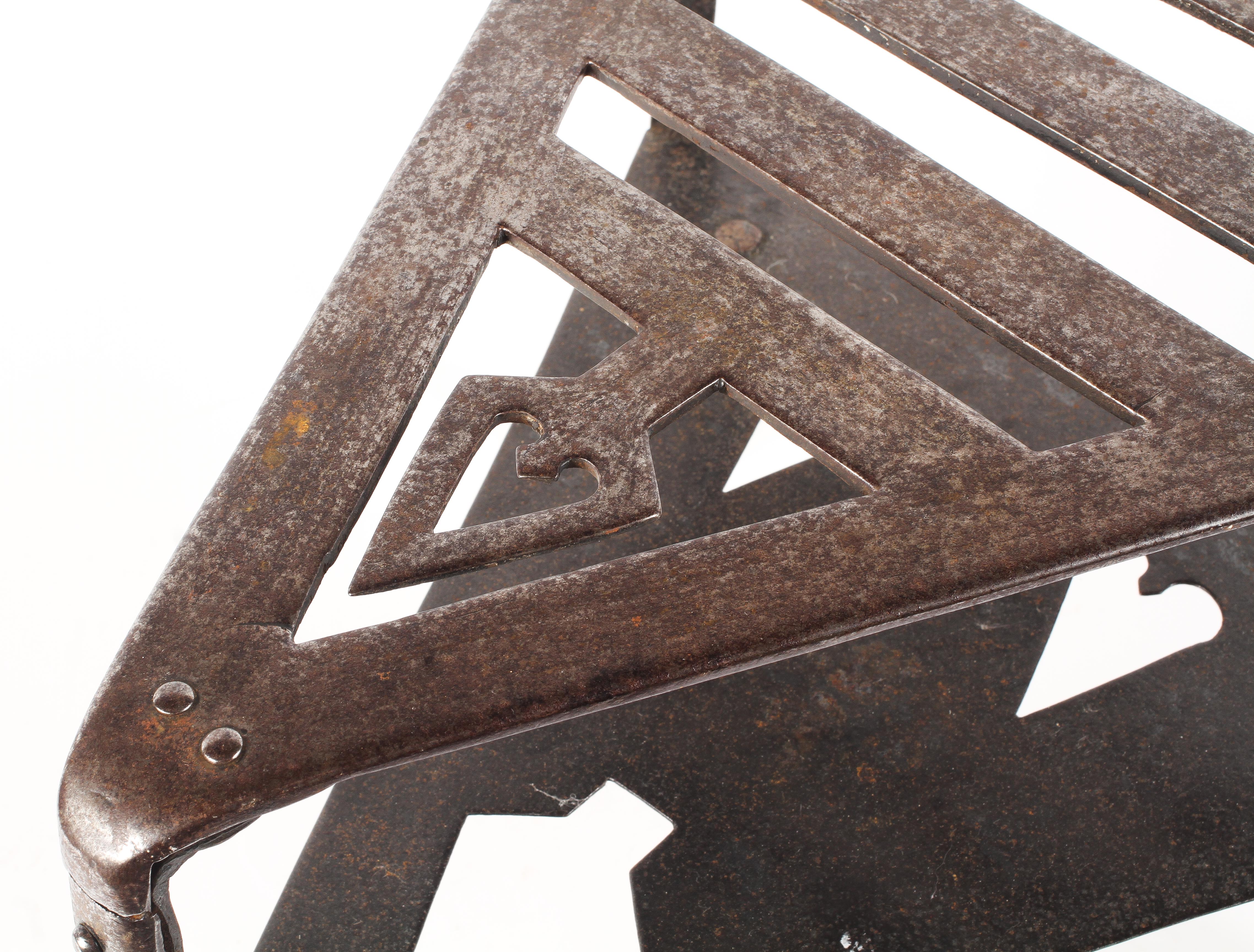 An Arts and Craft style early 20th century cast metal stand, of triangular form with two tiers, - Image 3 of 3