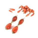 A coral bar brooch of unusual form and a pair of drop coral earrings