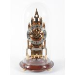 An Elliot (London) brass skeleton clock on stand within glass dome, of Gothic form,