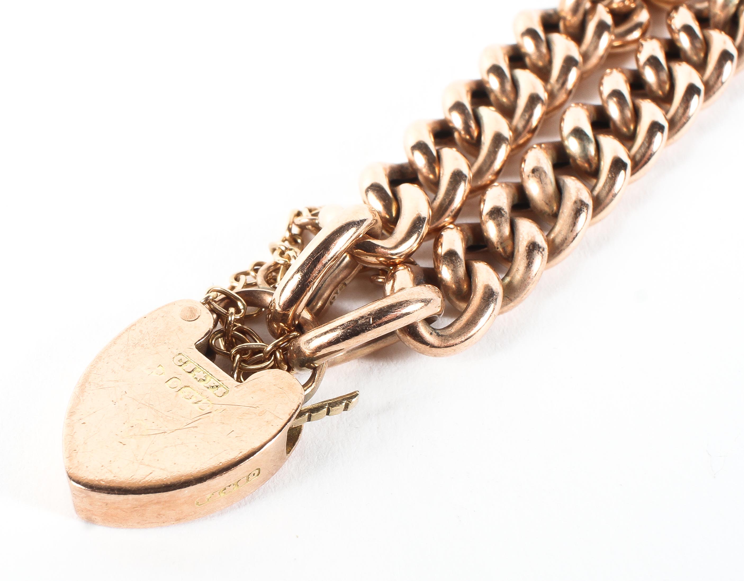 A 9ct rose gold curb link bracelet with heart locket, - Image 2 of 2