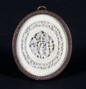 A late 19th century Chinese carved oval plaque in gilt metal frame,