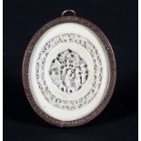 A late 19th century Chinese carved oval plaque in gilt metal frame,