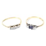 Two 18ct gold and platinum set rings, one with a central sapphire flanked by two diamonds,