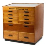 A beech shop counter cabinet, stamped Windsor and Newton,